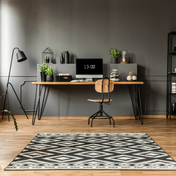 Tidy home office with a desk and lamp