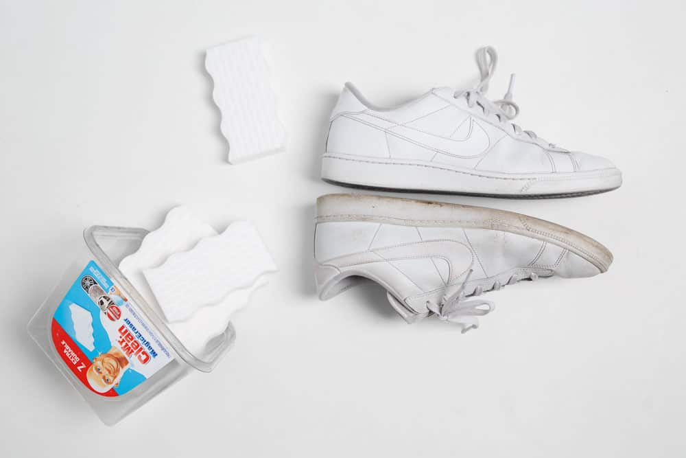 White sneakers next to a melamine sponge