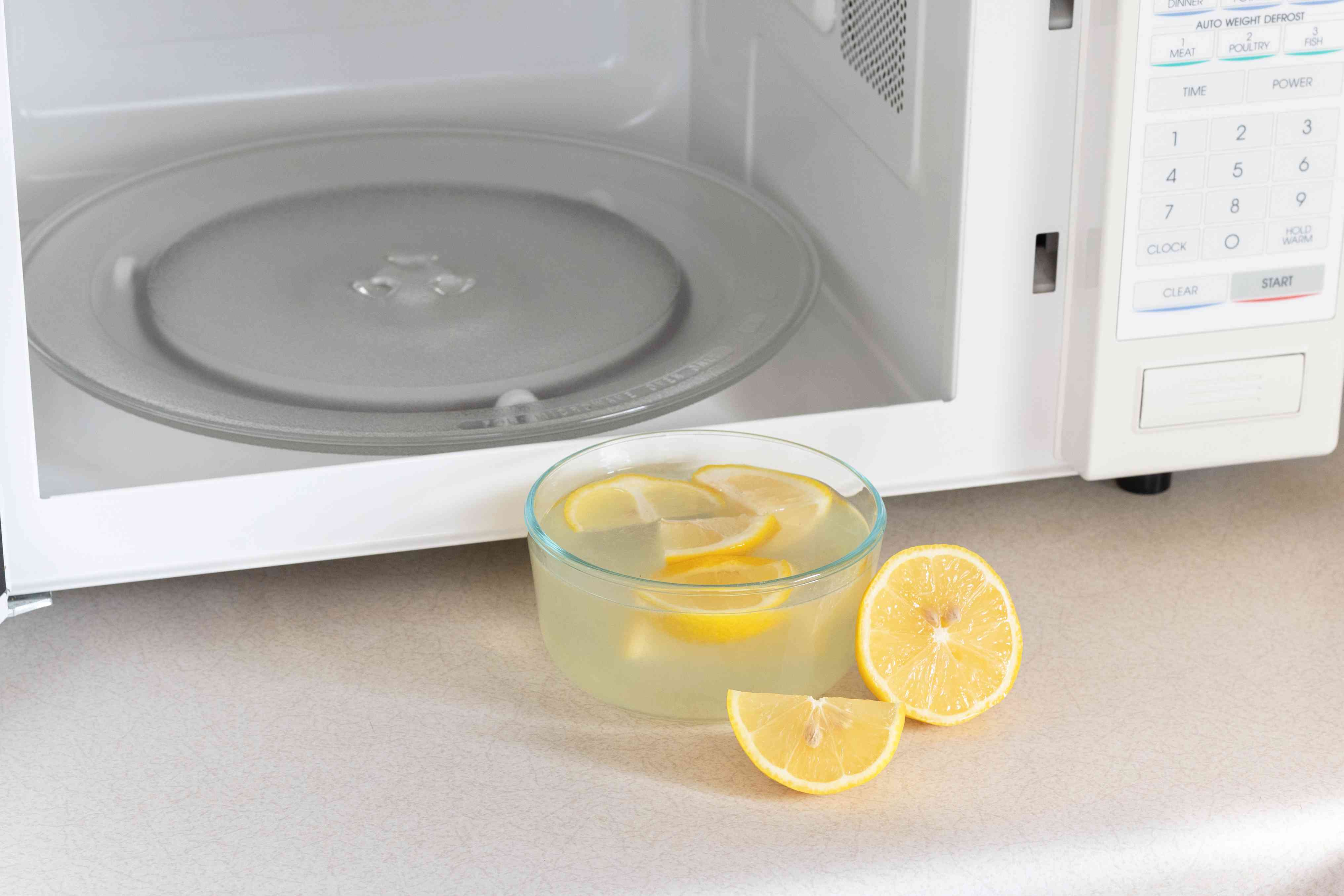 Bowl of lemon water inside a microwave