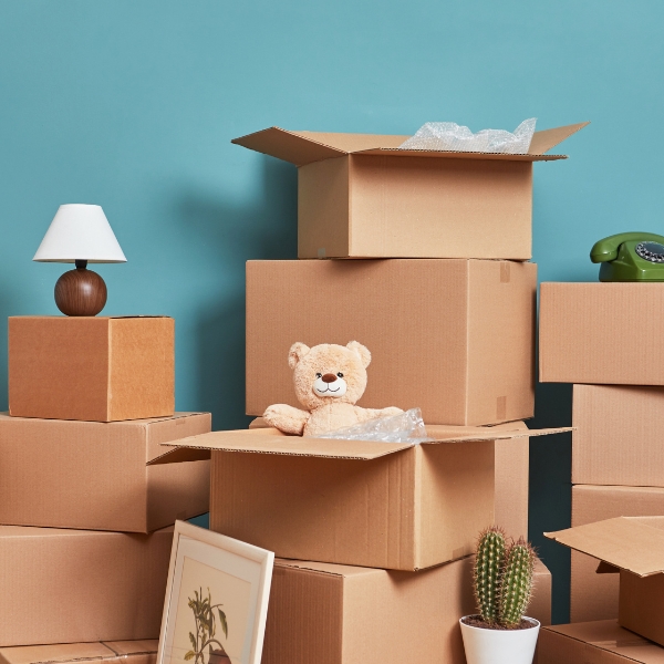 Packed moving boxes in an empty room